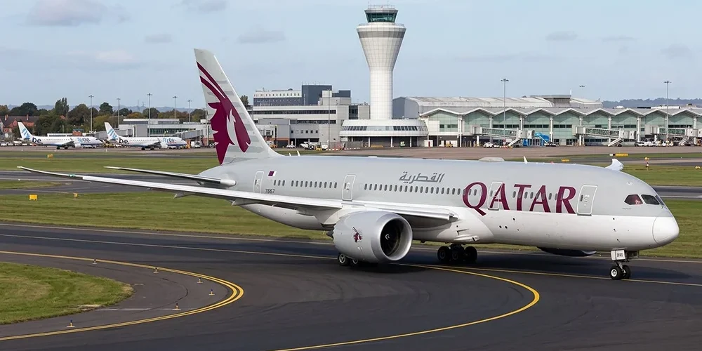 Qatar Airways Boeing 787 on the stand at Birmingham Airport ahead of its flight to Doha